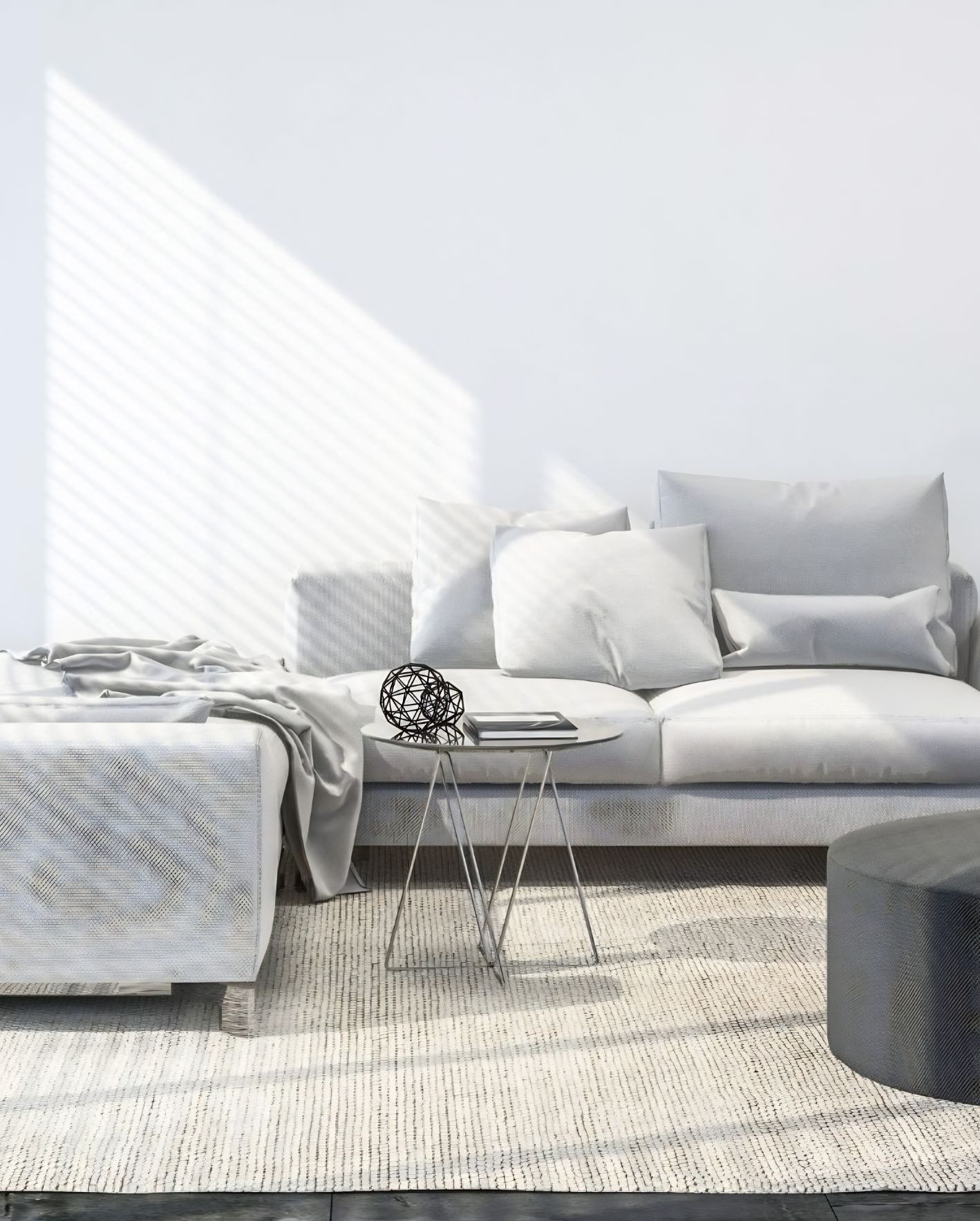 Bright Orlando Airbnb living room with white sofa, neutral decor, and natural light for a protected short-term rental property.
