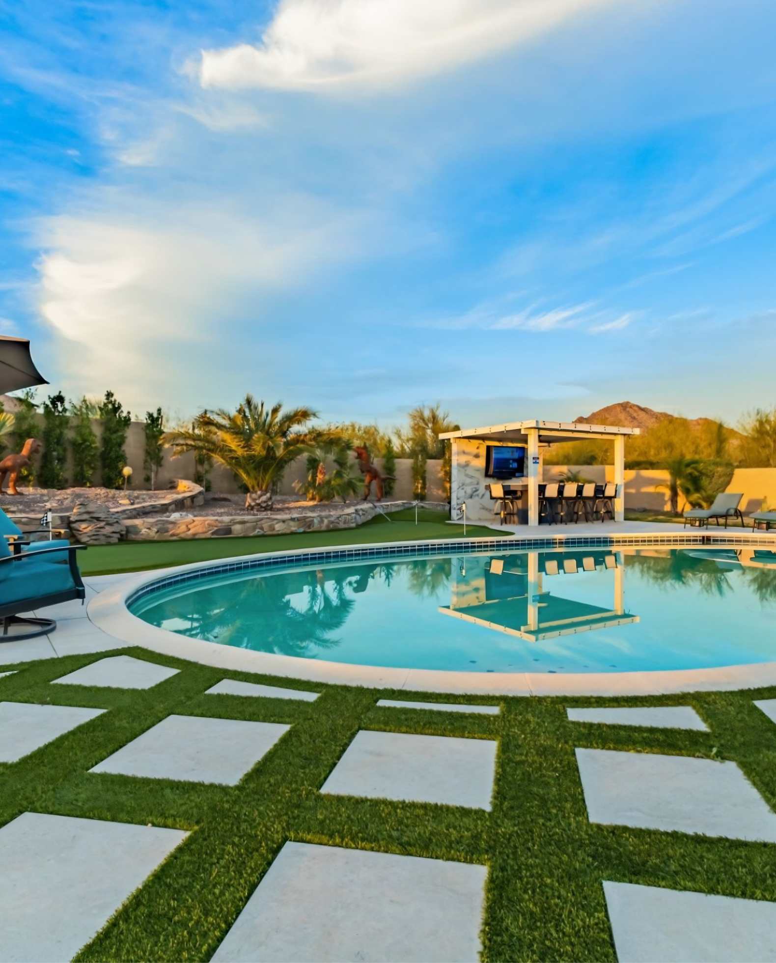 Luxury Scottsdale Airbnb vacation rental with resort-style pool, outdoor entertainment area, and desert mountain views protected by Airbnb host insurance services.