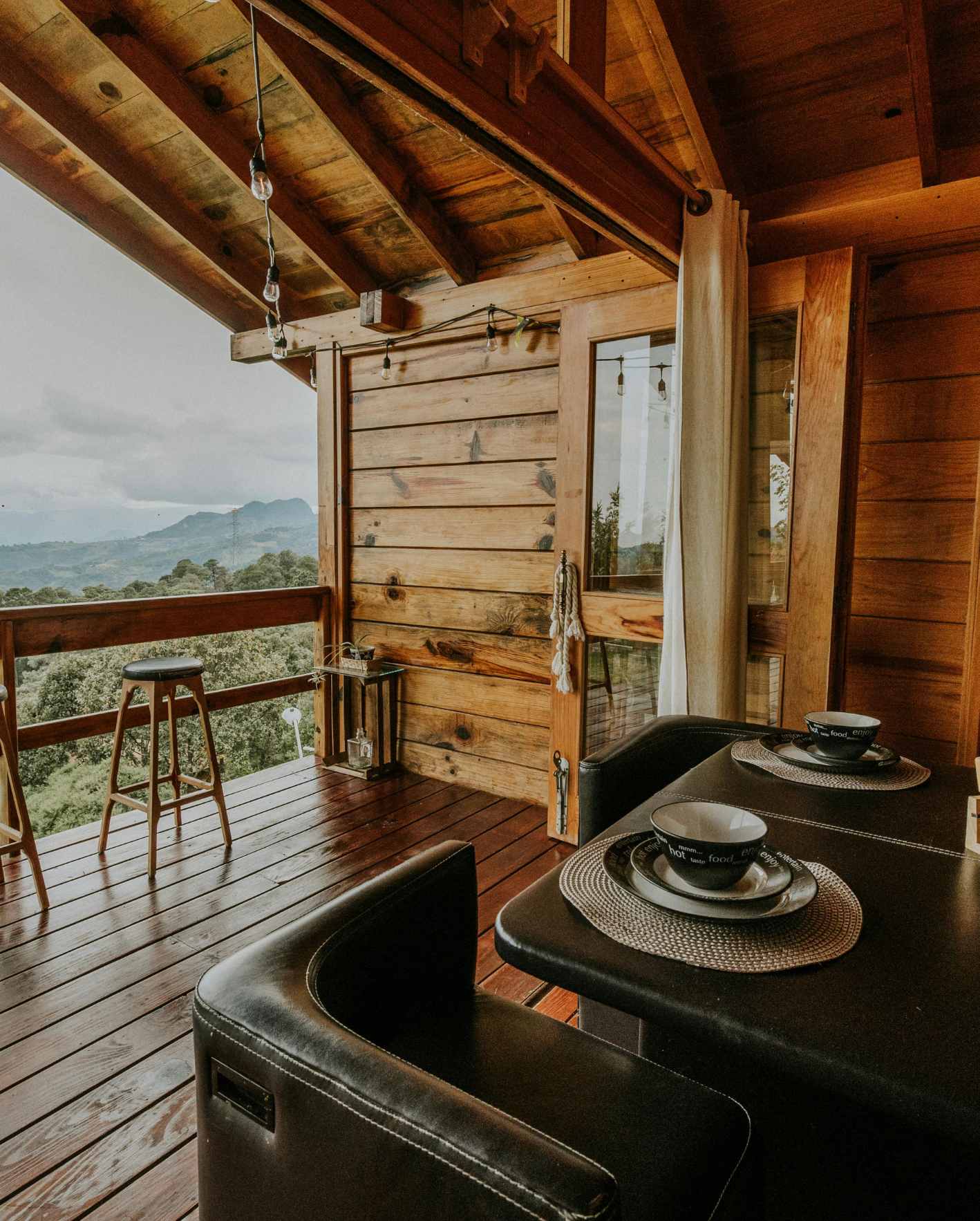A cozy, professionally prepared short-term rental patio with mountain views and outdoor dining, highlighting the guest-ready details Park Place Properties helps owners manage through hands-off Airbnb hosting support.