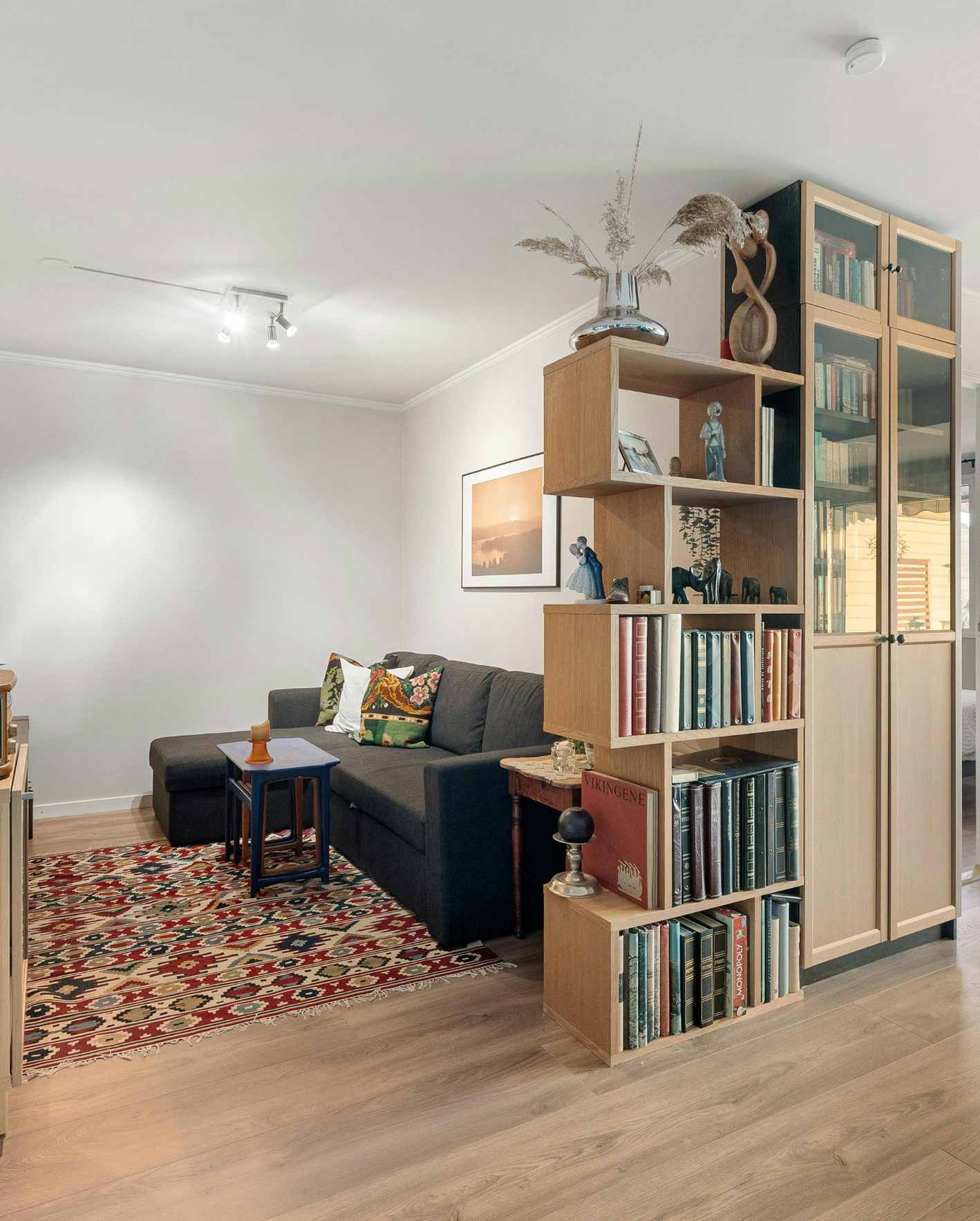 A professionally styled short-term rental living space with modern furniture, bookshelves, and warm design details, highlighting how Park Place Properties helps Miami Airbnb owners improve listing appeal, guest experience, and booking performance.