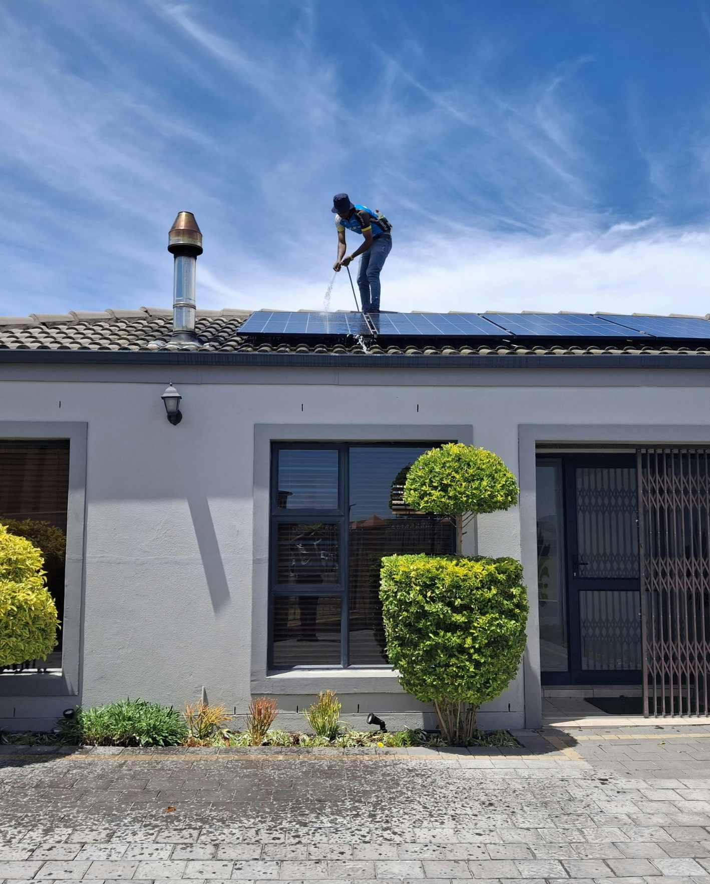 A property maintenance professional working on rooftop solar panels, highlighting how Park Place Properties helps Miami short-term rental owners protect their investment with proactive maintenance, vendor coordination, and hands-off property care.