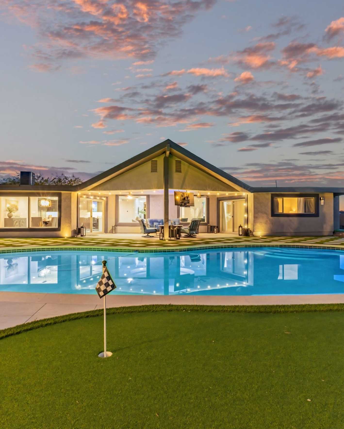 Luxury Scottsdale Airbnb with resort-style pool, putting green, and modern outdoor living space designed for high-performing short-term rental SEO listings.