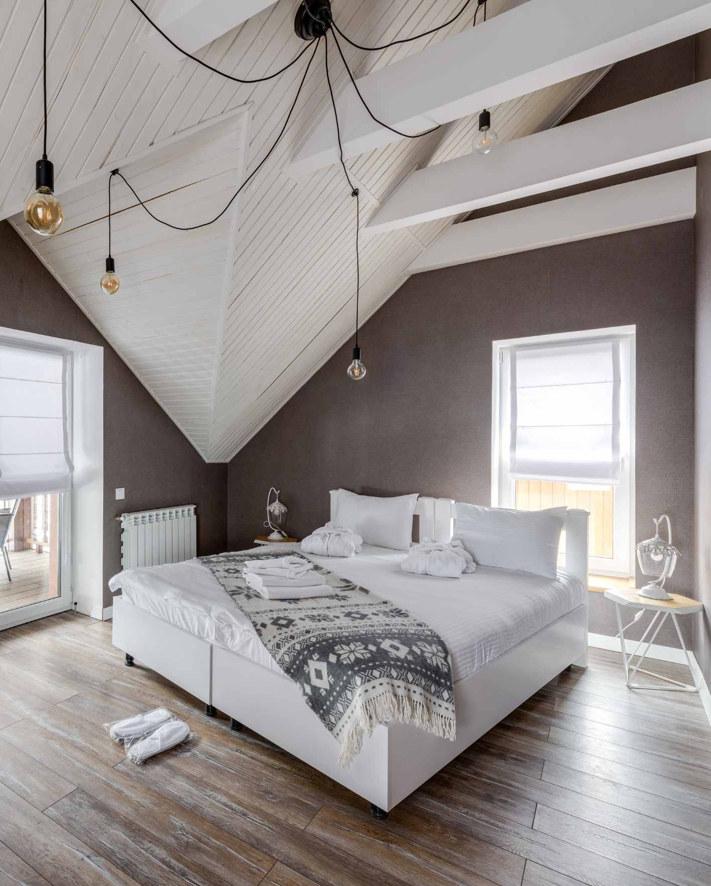 A bright, professionally staged short-term rental bedroom with fresh linens, guest robes, and polished design details, showing how Park Place Properties helps Miami Airbnb owners improve guest appeal, listing quality, and booking performance.